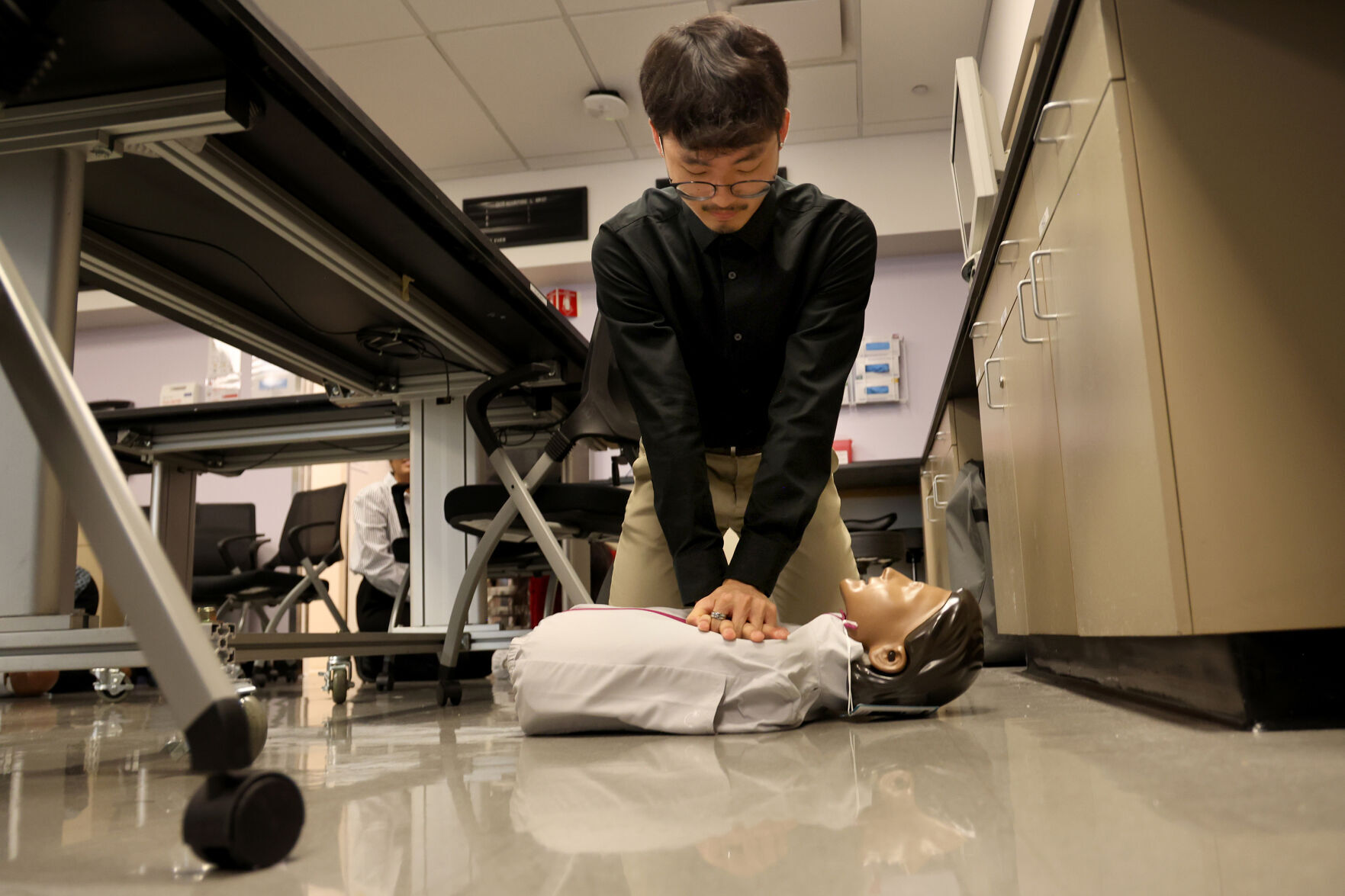 Under a Northwestern program called ChicagoCHEC,, undergrads and recent graduates, including Eric Mun, who are interested in medical school, take part in a hands only CPR simulation, demonstration and tour at a Northwestern surgical bio sills simulation lab, in Chicago, Monday, July 21, 2025.